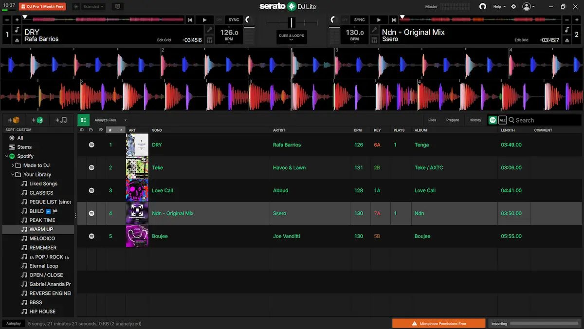 Spotify abierto en la biblioteca de Serato DJ Lite con playlists y dos decks cargados
